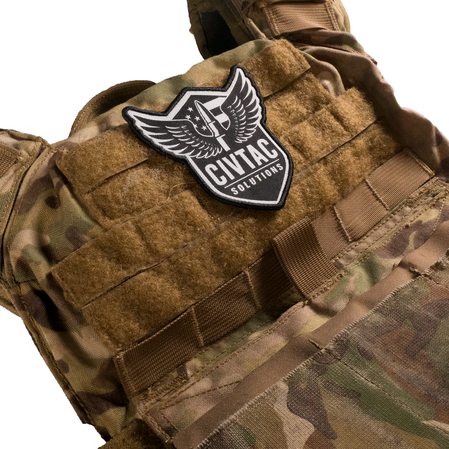 Camouflage tactical vest with a CIVTAC Solutions patch on a white background